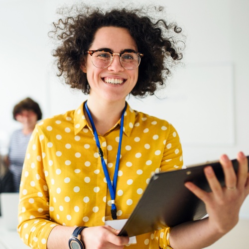 Joyful teacher who successfully implemented AI graders into her classroom to enhance the learning experience for her students