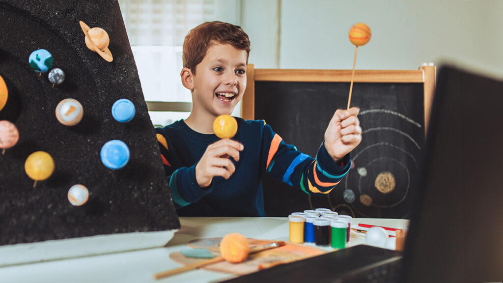 Student presenting group project that a teacher creatively assigned him with AI