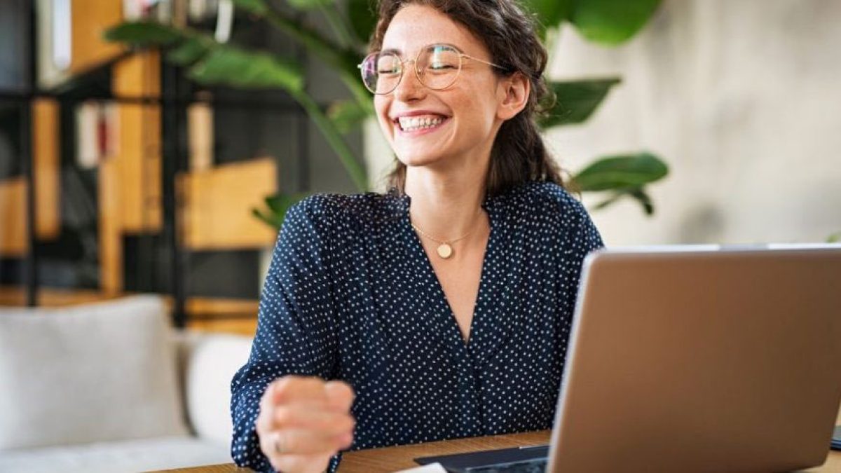 Female english teacher excited to learn what an ai grader is and how he can use it to save time